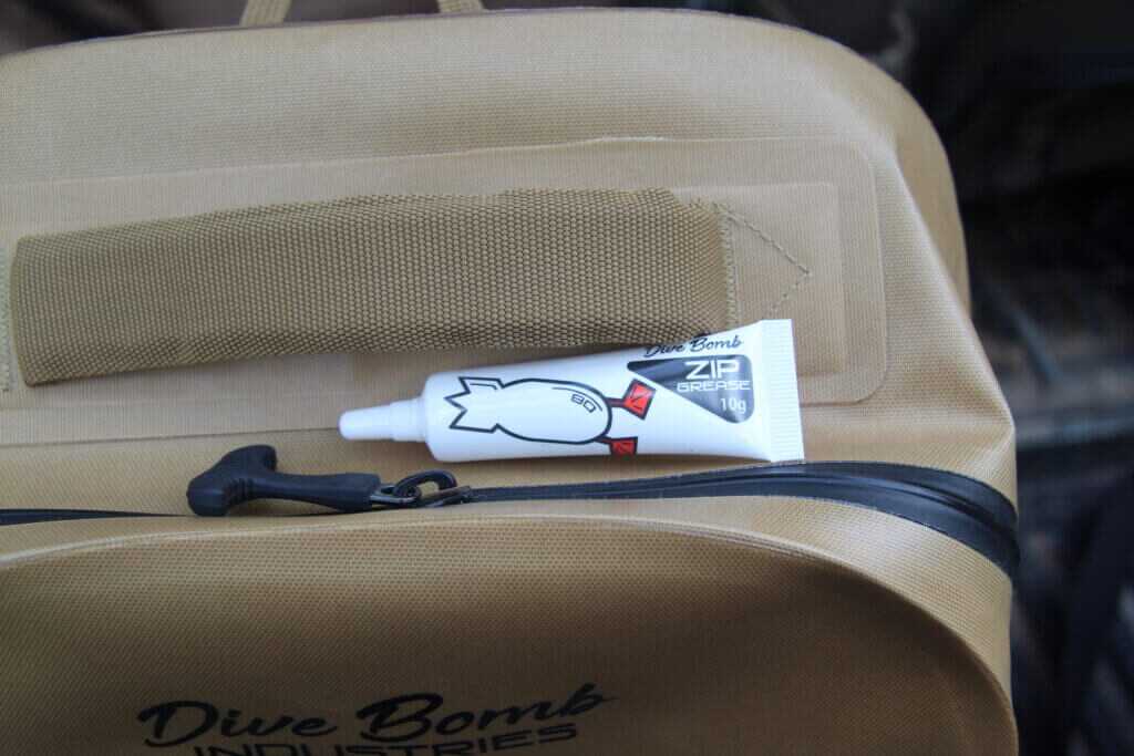 Included DB Zip Grease for maintaining the Dive Bomb Waterproof Zip Backpack zipper