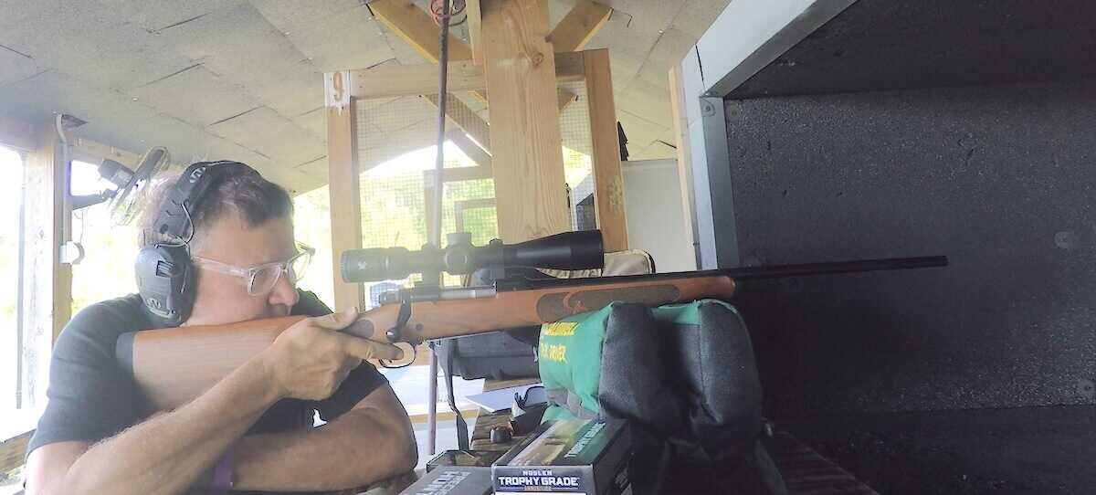 Shooter testing a Winchester Model 70 Featherweight 6.5 Creedmoor at the bench, best classic 6.5 Creedmoor for deer hunting 2026