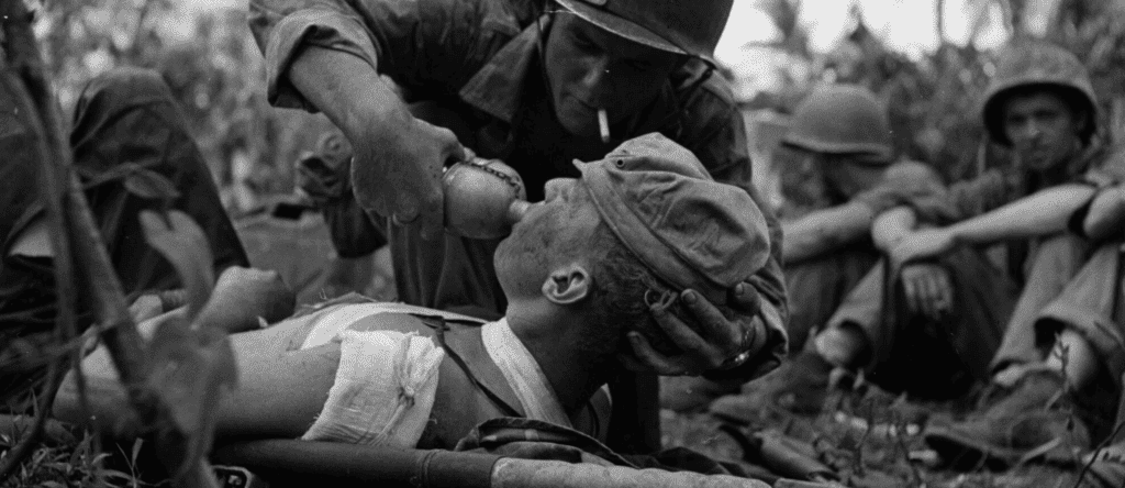 World War 2 Navy medics improvising medical care with limited equipment