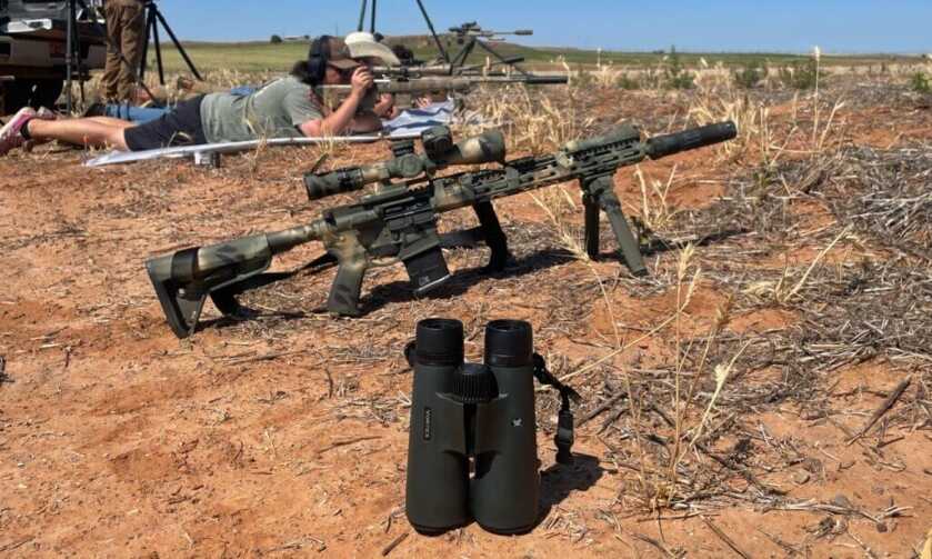 Vortex Triumph 12x50 HD binoculars used at the shooting range for spotting targets and calling hits