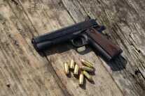 Colt 1911 pistol with 45 ACP ammunition