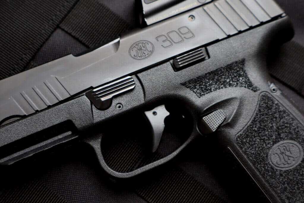 FN 309 MRD controls showing takedown lever, magazine release, and slide release