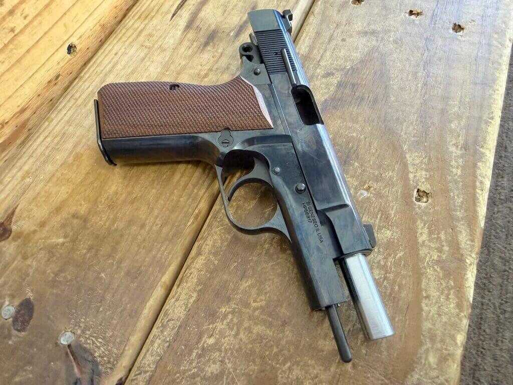 Springfield SA-35 4 inch Polished with slide locked back showing recoil guide rod