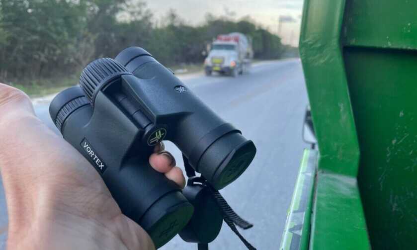 Vortex binoculars photographed in the back of a modified truck during an excursion in the Dominican Republic