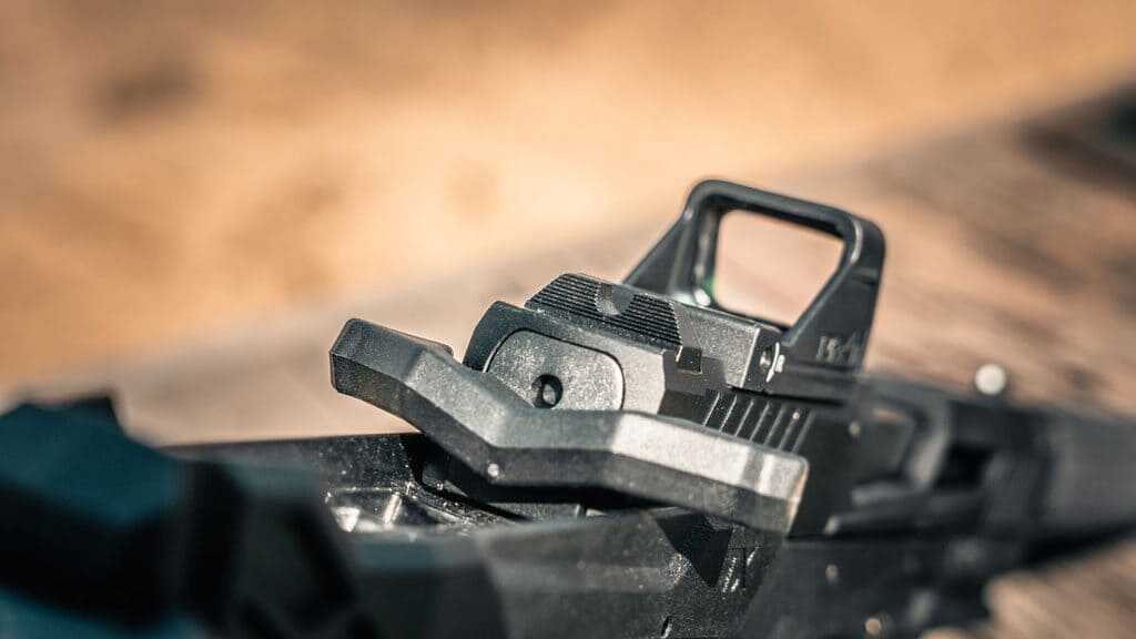 Ambidextrous charging handle on Taurus TX22 Braced .22 LR pistol extending from both sides of slide