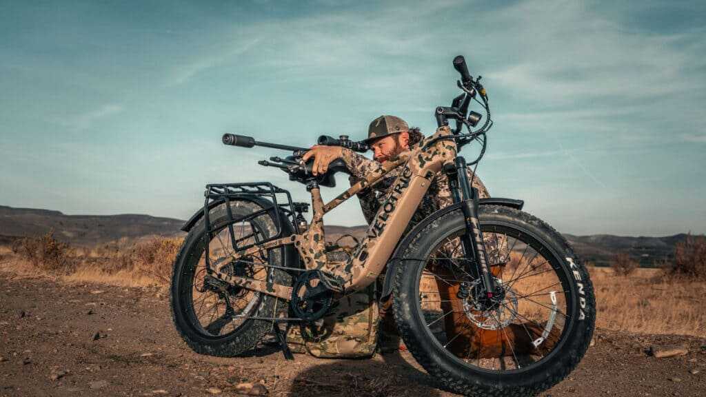 Velotric Nomad 2X hunting e-bike with full suspension and fat tires in off-road terrain