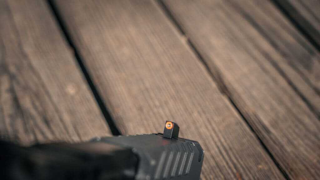 Springfield Echelon Pro orange-ring tritium front sight and serrated black rear iron sight configuration
