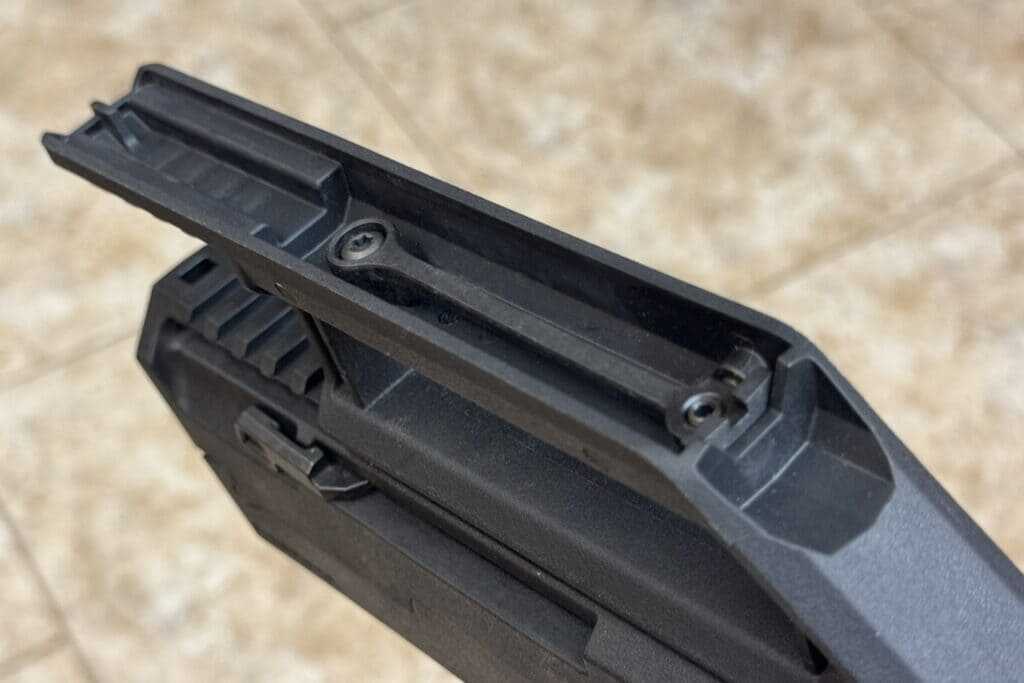 Close-up of polymer iron sights integrated into ZEV FDP folding 9mm carry handle