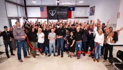 Watchtower Defense employees and guests celebrate the opening of the company’s new Tomball, Texas, headquarters.
