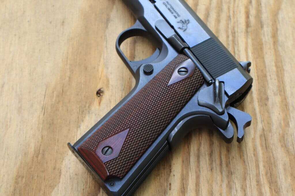 Colt Government Model .45 ACP 1911 thumb safety, magazine release, slide release, and trigger controls