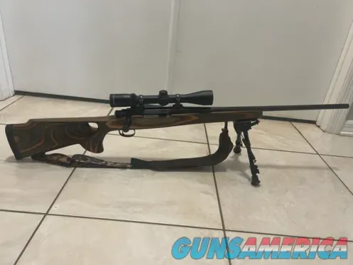 Bolt-Action Rifle with Scope, Bipod, and...