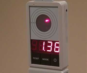 The instant the laser hits the "strike zone" of the target; the timer stops and displays your time.