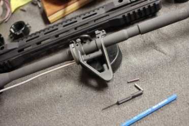 Parallax Tactical's Long Slim Forends Removing the sight-post isn't difficult. Punch the pins and it slides off.