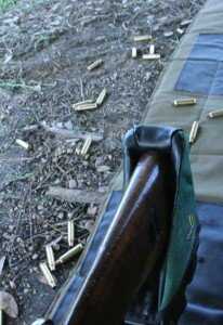 The brass flies pretty much straight up, so if you are standing it goes forward, and prone it goes back. 