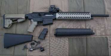 This is the RAAC MKA-1919 after it has been tricked out by Tooth and Nail Armory. The removed pieces are laid out around the updated gun. 