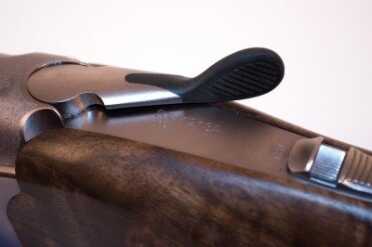 A Beautiful Beretta: The New 692 Sporting B-Fast Over/Under Shotgun The opening lever has a rubberized thumb surface for non-slip operation.