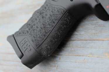 This extension on the back of the grip helps keep the mag from catching on your hand when you drop it. 