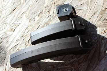 The mags rock in slightly and catch on this post on the back. The BX-15 is my new favorite. It fits neatly in a pocket.