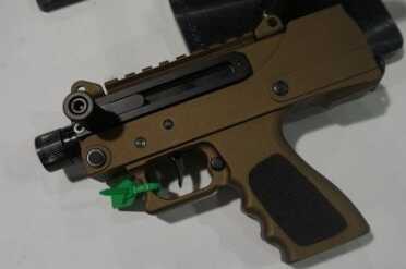9mm MAC-10 Takes Glock Mags - Masterpiece Arms DMG - SHOT Show 2015 The large charging handle will make charging easy.