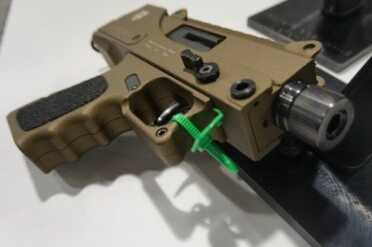 9mm MAC-10 Takes Glock Mags - Masterpiece Arms DMG - SHOT Show 2015 The Cerakote looks good on the gun--a nice break from the traditional black.