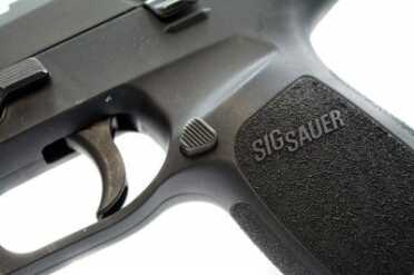 The magazine release button can be moved to the opposite side.