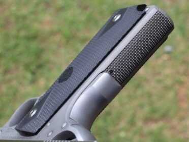 Mainspring checkering, grip safety bump and the black rubber grips. 