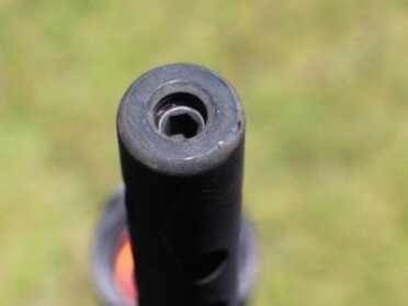 The tube is blocked on this end. This is the small detail that would make shooting a live round dangerous/deadly.