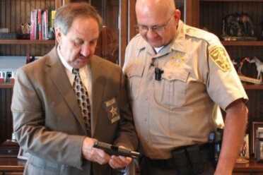Alabama Sheriff Gives Deputies Free Off-Duty Concealed Carry Guns "DeKalb County Sheriff Jimmy Harris inspects the new shipment of concealed carry handguns for his deputies." (Photo: YellowHammer News)