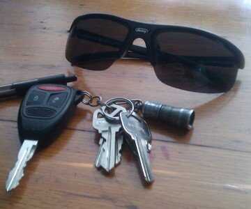 The Streamlight is the little silver tube on the key chain. This is about as small as lights come.