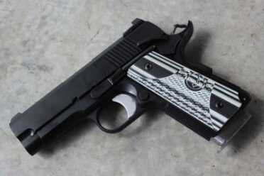 With the ECO's shorter girp, a full sized mag sticks out slightly. Short mags fit flush.