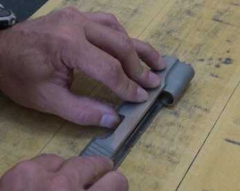Hand Building a Custom 1911 (The Bob Marvel Way) After blasting, the author carefully polishes the flats for a contrast finish.