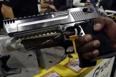Shootable Gold Plated Tommy Guns, Stainless Desert Eagles - Thompson & Magnum Research - SHOT Show 2016 The famed Desert Eagle now comes in three fat calibers, and all three work off one frame.