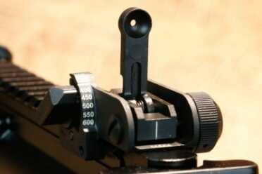 As Close to an M16 as You Can Get: FN's Military Collector Series The rear sight is windage and elevation adjustable with a single flip up aperture