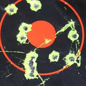 As Close to an M16 as You Can Get: FN's Military Collector Series 100 yards 10 rounds in the long ragged hole