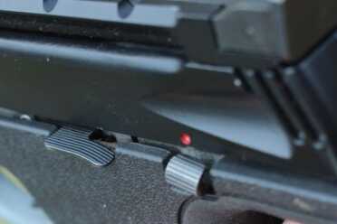 The Used Market--The Smith and Wesson 22A Safety off. Slide release in front of safety.