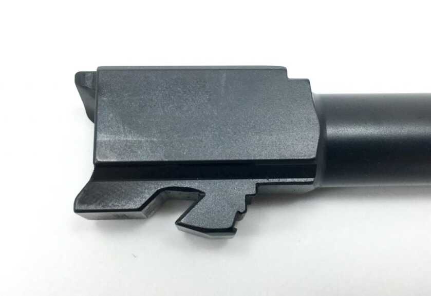 The ramped lug on this Glock 19 barrel tilts the barrel down, unlocking it from the slide.