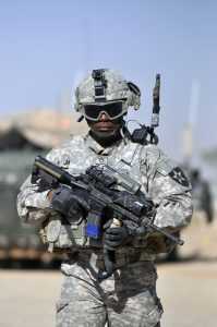 FN Military Collector Series M4—True Mil-Spec 5.56 Carbine! Full Review A U.S. Soldier conducts a walk-and-talk through a market in Nassir Wa Salaam, Iraq. He is carrying an M4 Carbine. Image courtesy of DoD.