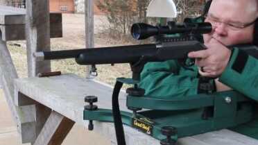 The author sights in his terrorist hunter rimfire on the range. 