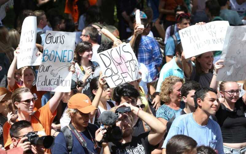 ‘Cocks Not Glocks’ Hands Out Dildos to Protest Campus Carry in Texas (Photo: Tom Reel, San Antonio Express News)