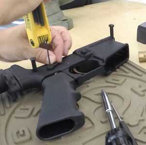 Step 4: Install the selector after placing the selector label on the other side of the lower. The author is shown here installing the right-side ambidextrous lever.