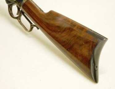 Cowboy Time Machine: Uberti 1873 Carbine—Better Than The Original? Full Review. Note the attractive grain of the walnut buttstock and the curved steel buttplate.