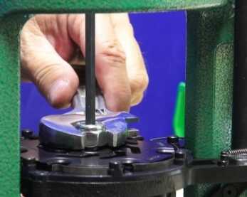 Setting the tension of the revolving shell plate is an important step for smooth function. 