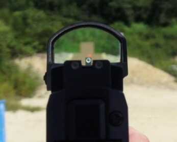 Sig's New P320RX Competition & Defense Pistol—Full Review The ROMEO1 co-witnessed nicely with the tall iron sights for the author.
