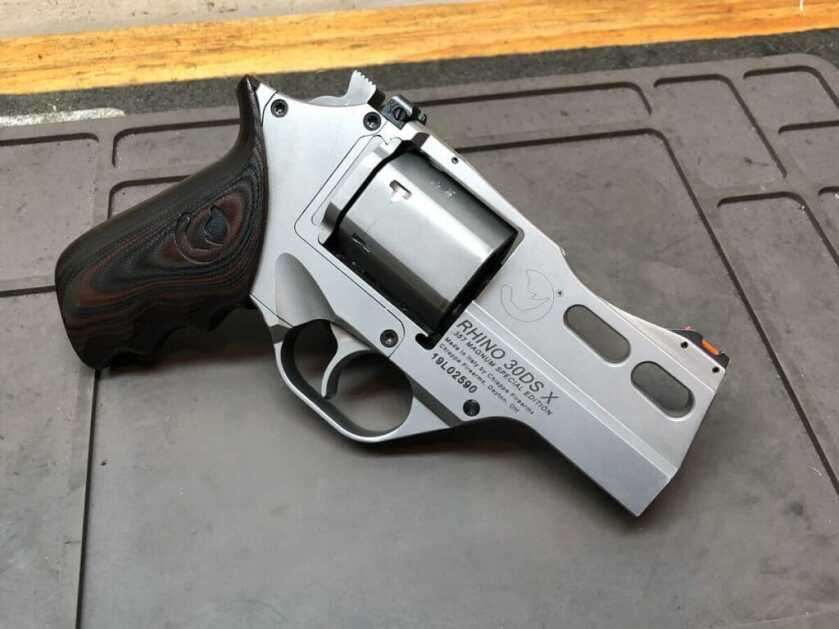 The Unique Chiappa Rhino Chiappa 30DS X revolver on a wooden table, symbolizing the blend of classic design with modern shooting innovation.