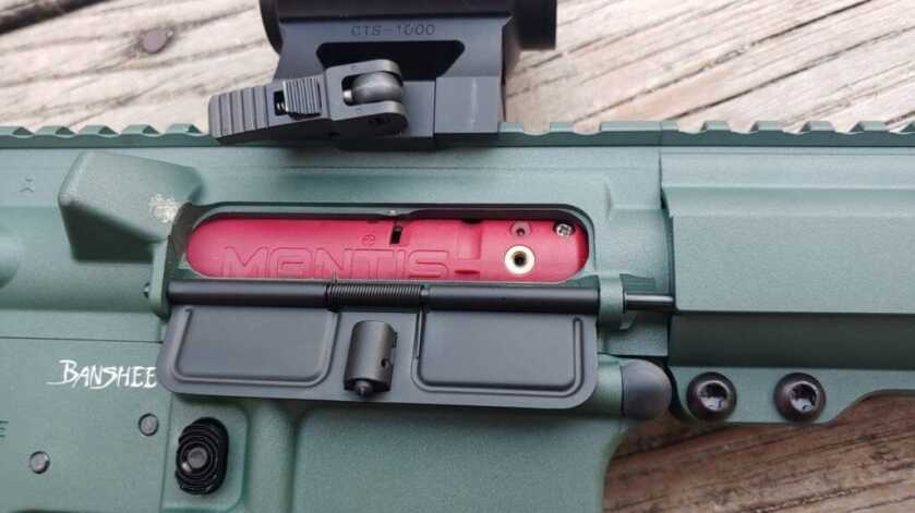 The Mantis Blackbeard - The Ultimate Dry Fire Tool Mantis Blackbeard laser windage and elevation adjustment slots visible through an AR-15 ejection port