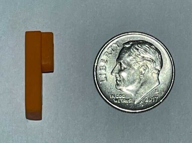The Stacker: The Next New Thing for Better Pistol Shooting? The Stacker shown next to a dime