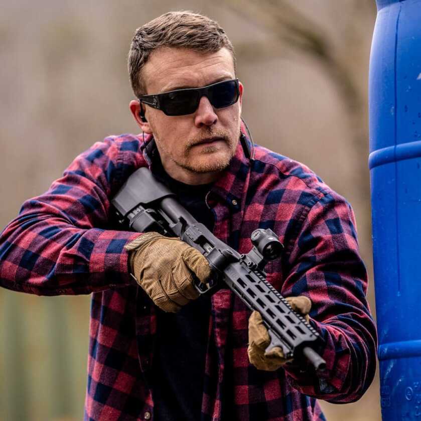 Man holding S&W FPC in 9mm.