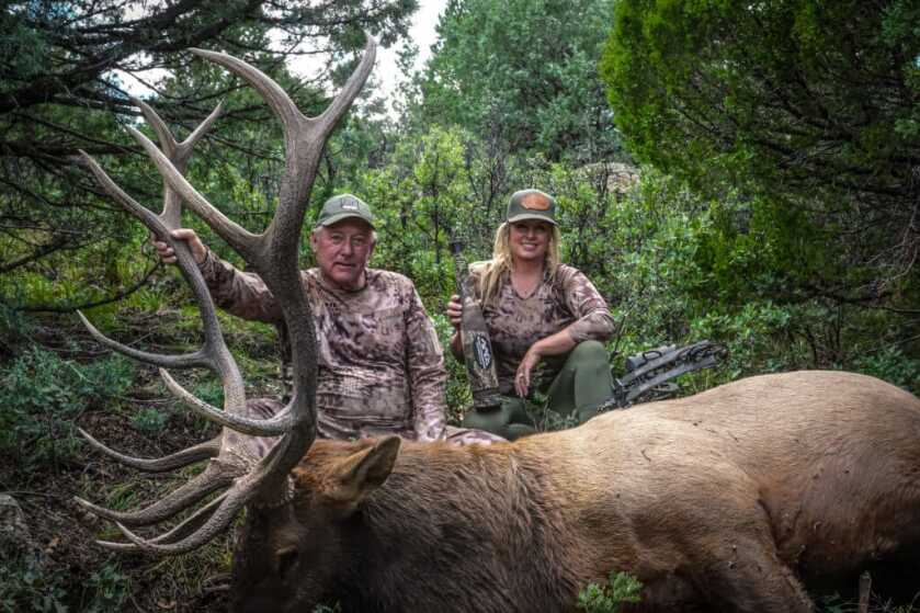 Father's Day Gift Guide Two hunters dressed in camo with huge elk and Rocky Mountain elk call