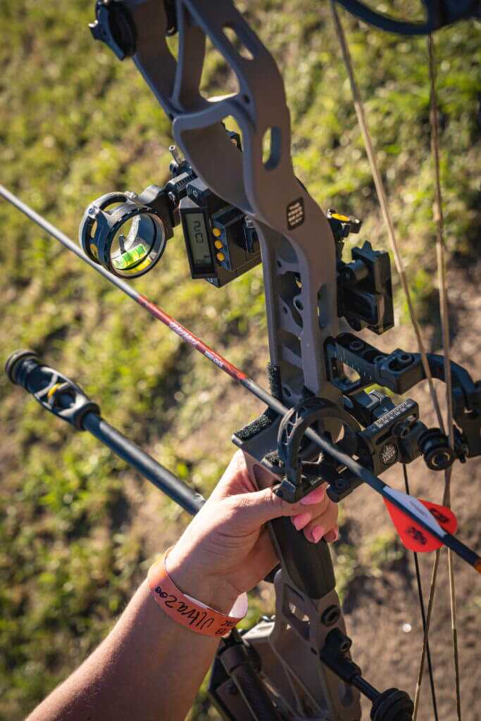 Father's Day Gift Guide Hunter holding bow and arrow