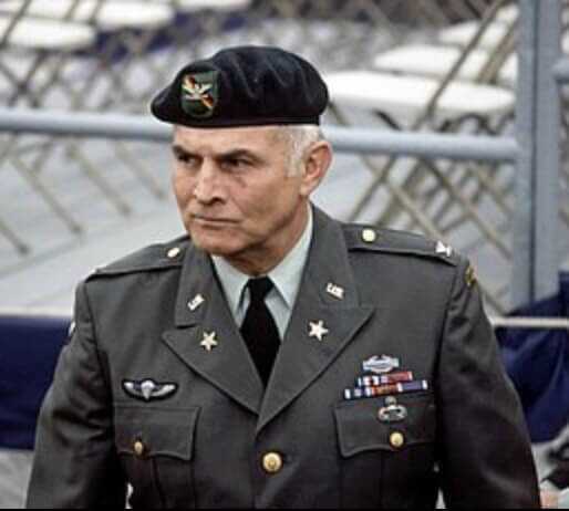 colonel charging charlie beckwith dressed in uniform